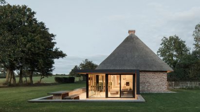 Thatched roof and glazed extension of Nieby Crofters Cottage by Jan Henrik Jansen and Marshall Blecher