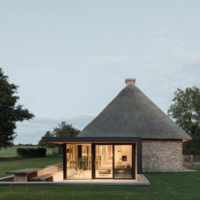 Thatched roof and glazed extension of Nieby Crofters Cottage by Jan Henrik Jansen and Marshall Blecher