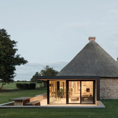 Thatched roof and glazed extension of Nieby Crofters Cottage by Jan Henrik Jansen and Marshall Blecher