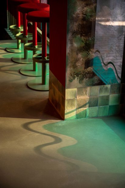Shadow of wave decal on floor of Warsaw bar