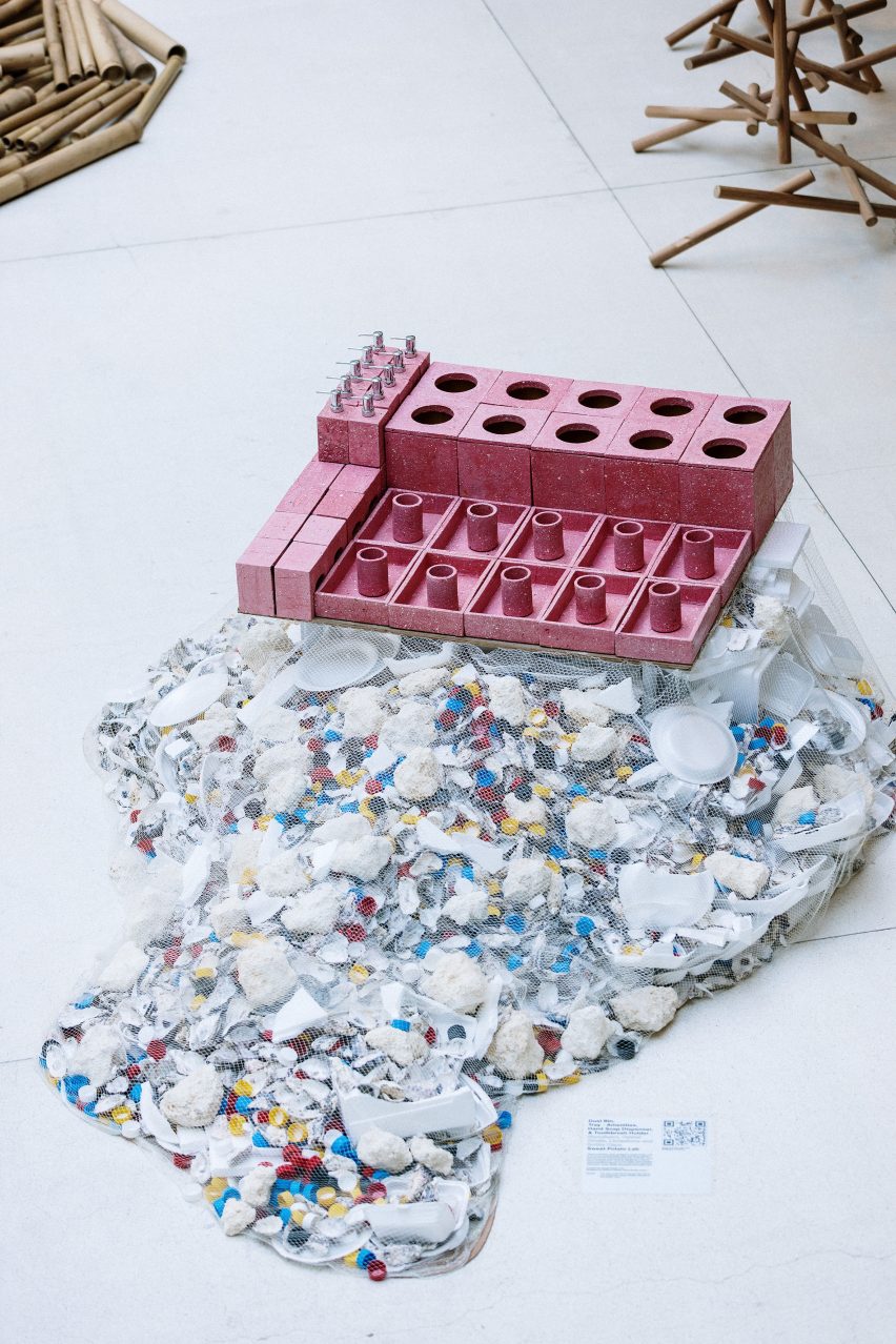 Accessories placed on piles of waste at Piles of waste at Nothing is Possible exhibition by Potato Head and OMA