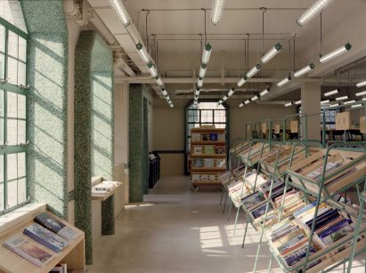 Supermarket-style shelves holding books in Deja Vu Recycle Store