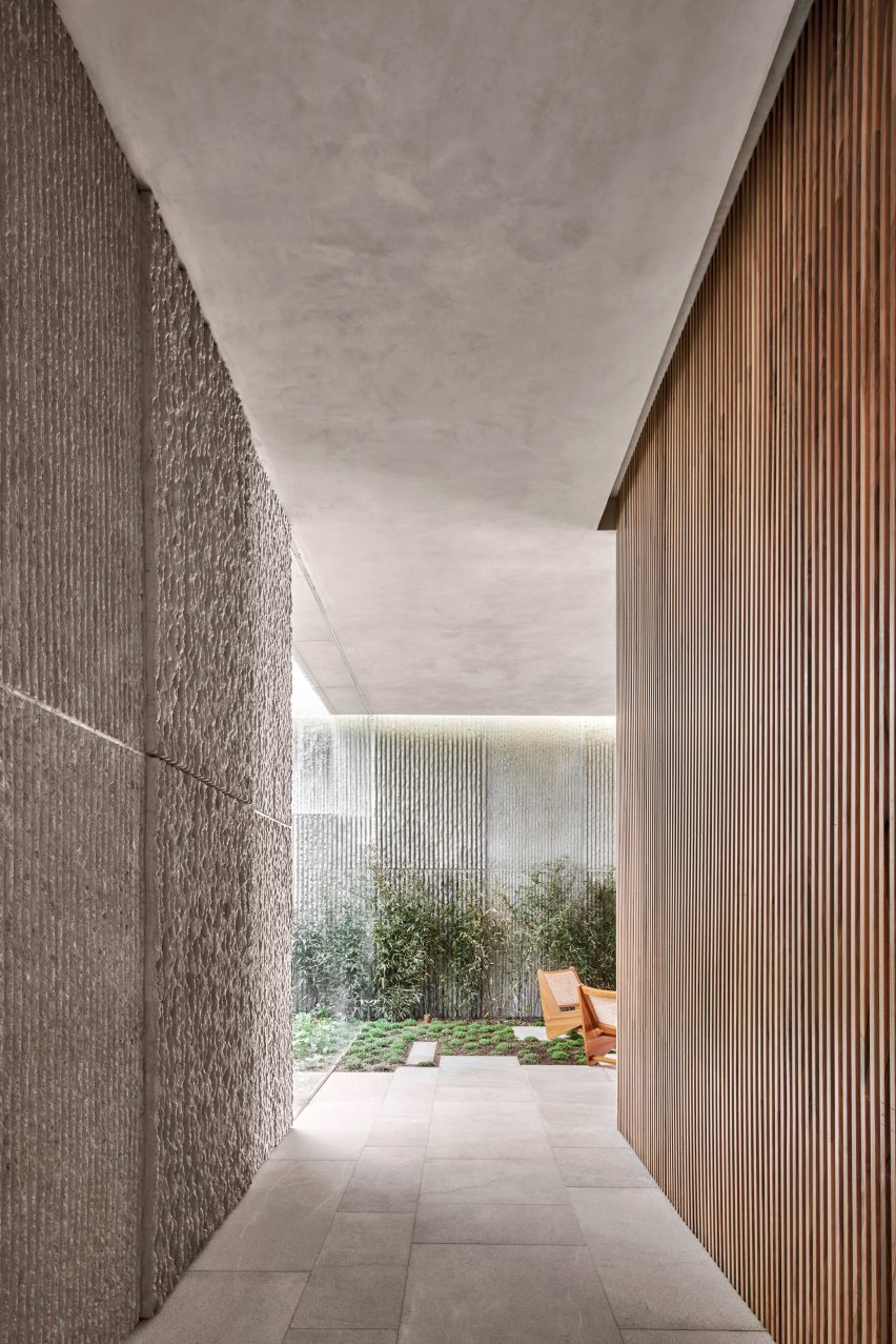 Wood screens and green courtyards define apartment block in Mallorca by OHLAB