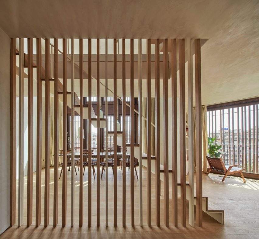 Wood screens and green courtyards define apartment block in Mallorca by OHLAB