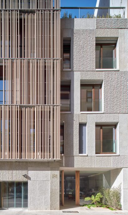 Exterior image of the concrete entrance to the Paseo Mallorca apartment block