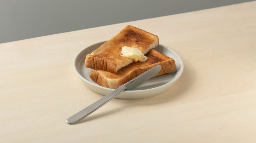 Oku knife by Kathleen Reilly balanced on the edge of a plate of buttered toast