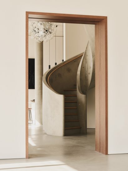 Spiral concrete staircase inside One Park Drive penthouse