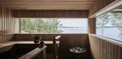 Wood-lined sauna by Studio Puisto