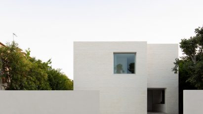 Exterior image of the white brick clad Brick House