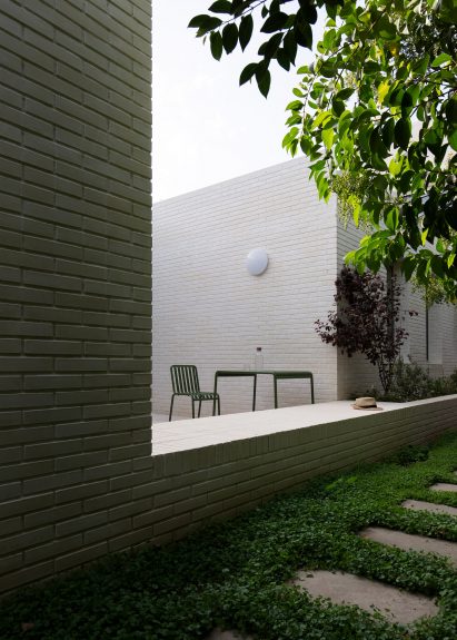 Exterior image of an outdoor dining area at the brick-clad Brick House