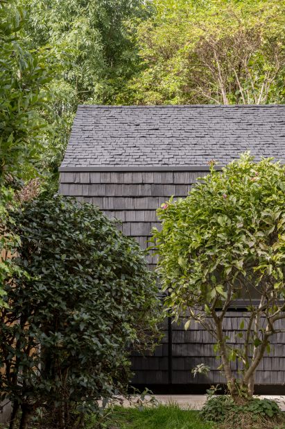 Garden studio with black shingles