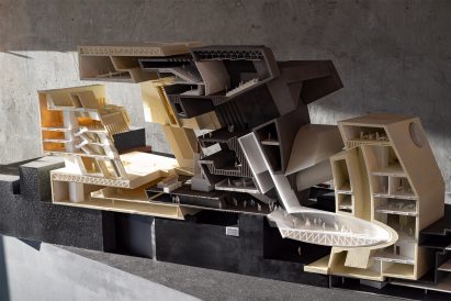 Sectional model of a large building made from beige and brown materials
