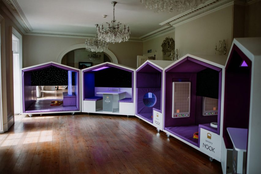 Photograph showing a row of sensory pods in high-ceilinged room