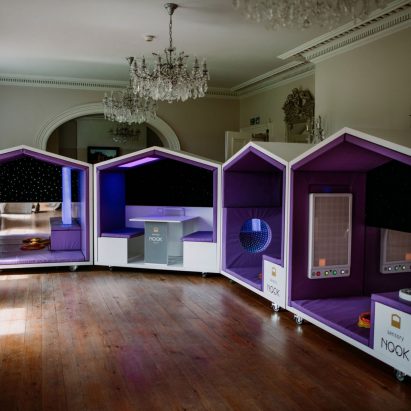 Photograph showing a row of sensory pods in high-ceilinged room