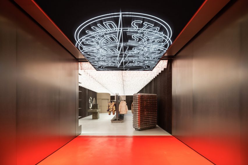 Store entrance with orange floor and digital chandelier