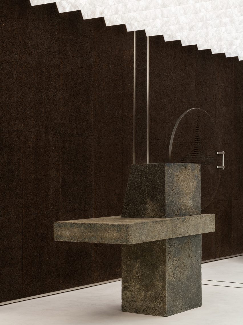 Burnt cork wall and sculptural display stand