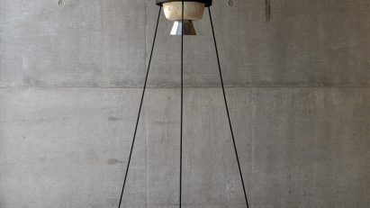 Living with Wildfire mycoremediation pod by Suzie McMurtry on metal stilts