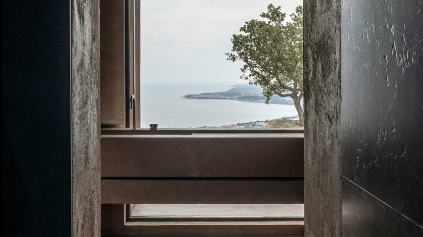 A bathroom sink overlooking a large window