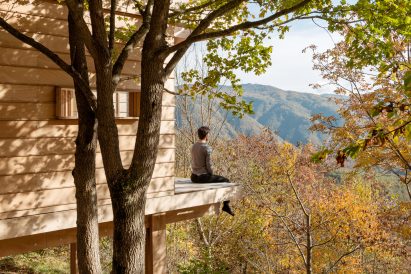 Person looking out from The Hermitage cabin