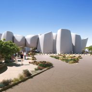 Cluster of white concrete buildings on sand