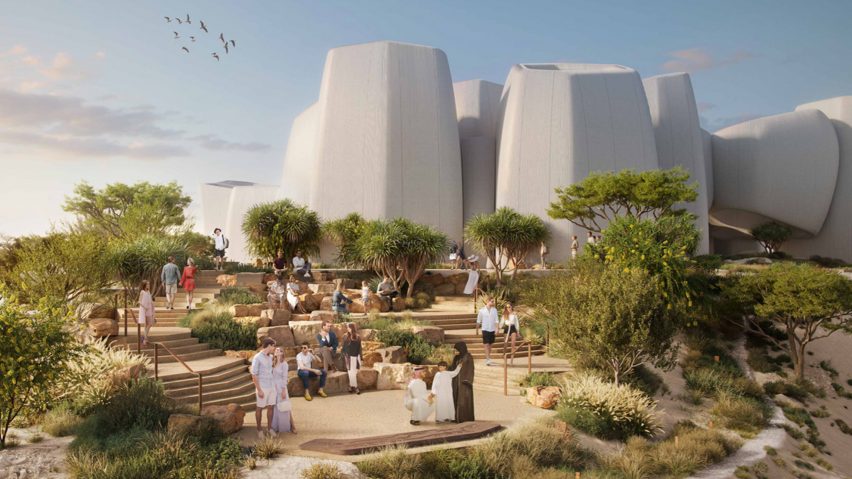 boulder-like white buildings on a sandy beach