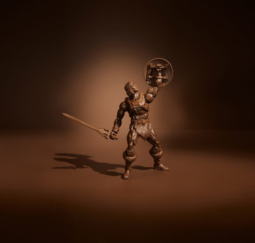 Dark brown He-Man collector figure holding up his shield