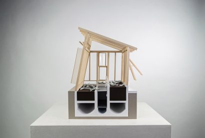 Handmade section model of a timber structure with sloped roof