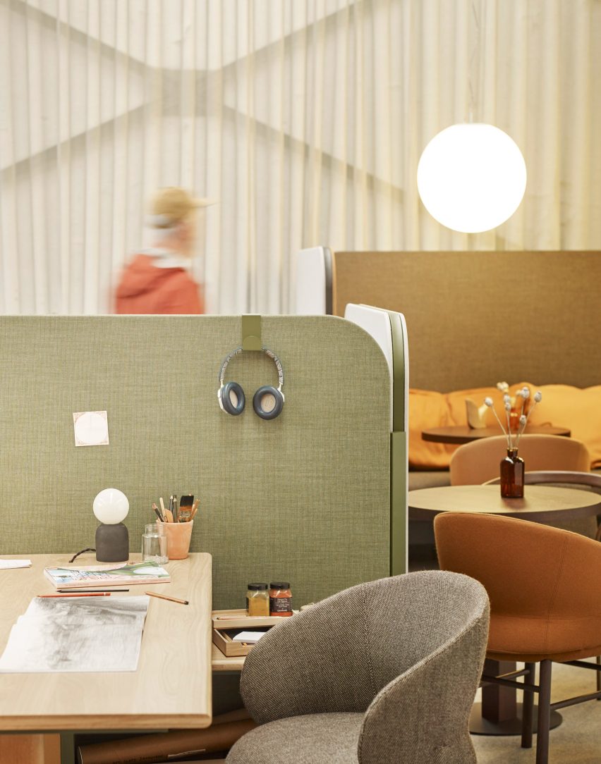 Figure in office with modular furniture system
