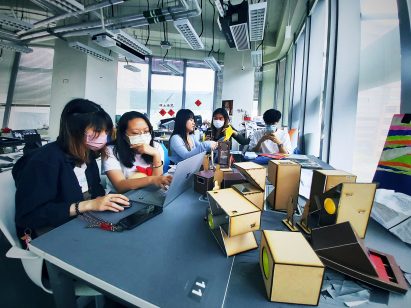 A number of students working together on a group project