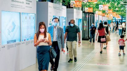 A group of people walking in a shopping centre in Hong Kong