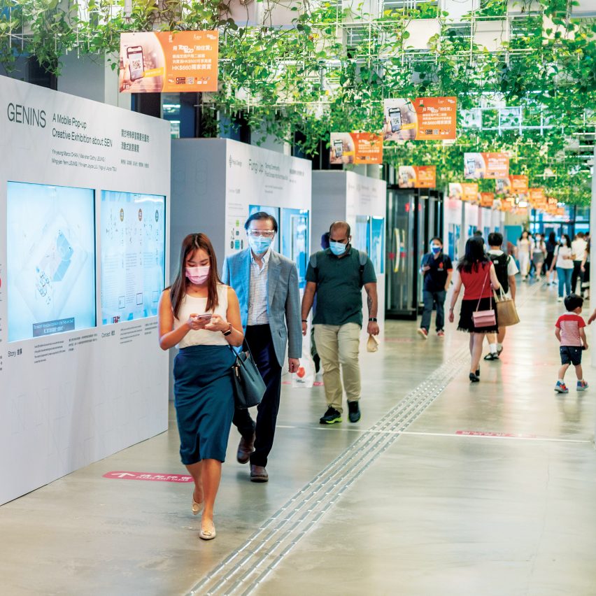 A group of people walking in a shopping centre in Hong Kong