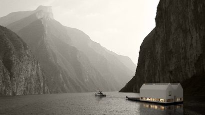 A photograph of building besides mountains