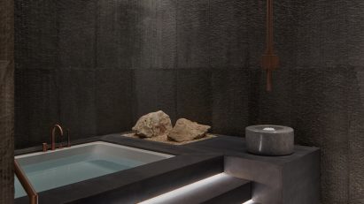 Spa bath with low light on the stairs to the pool