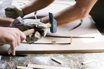 Photograph of people making the installation with wood