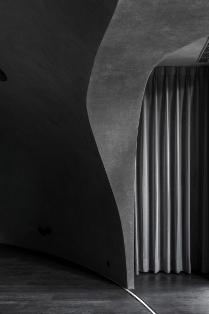 Photograph showing detail of grey wall