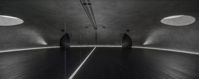 Large wood-floored yoga stusio with curvilinear walls and ceiling