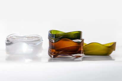 Glass vessels in various coloured trays