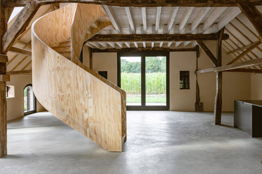 Plywood spiral staircase in Barn at the Ahof by Julia van Beuningen