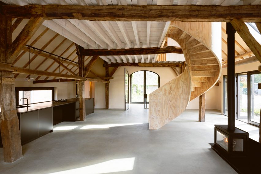 Plywood spiral staircase in Barn at the Ahof by Julia van Beuningen