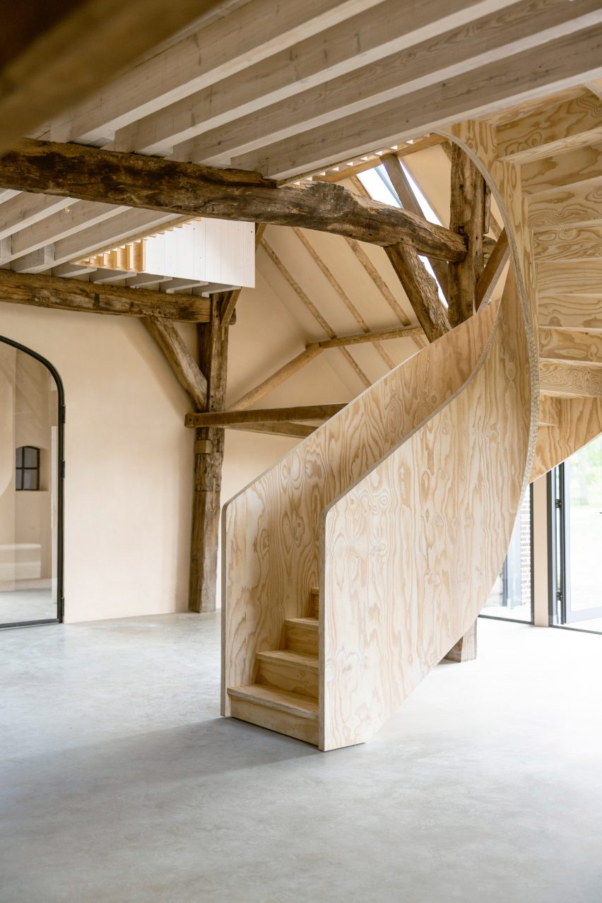 Plywood spiral staircase in Barn at the Ahof by Julia van Beuningen
