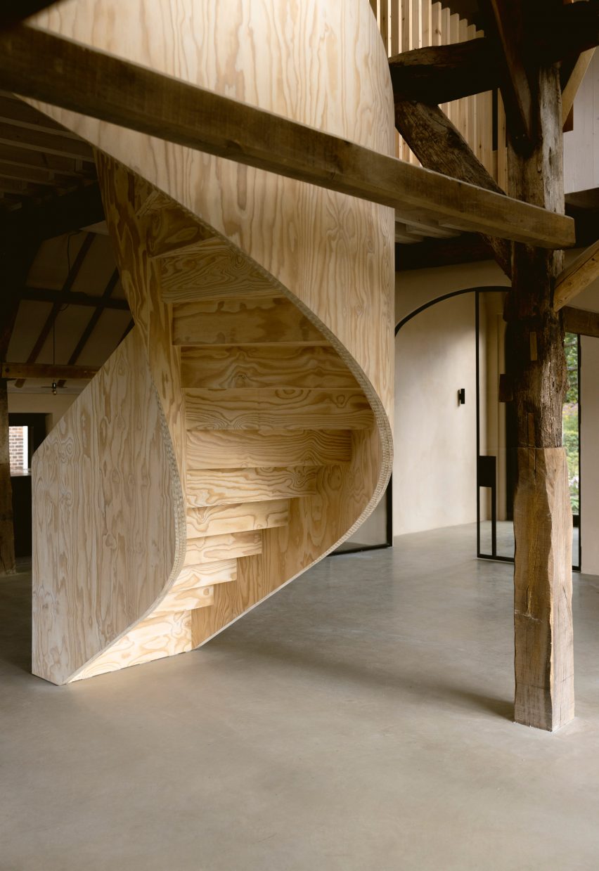 Plywood spiral staircase in Barn at the Ahof by Julia van Beuningen