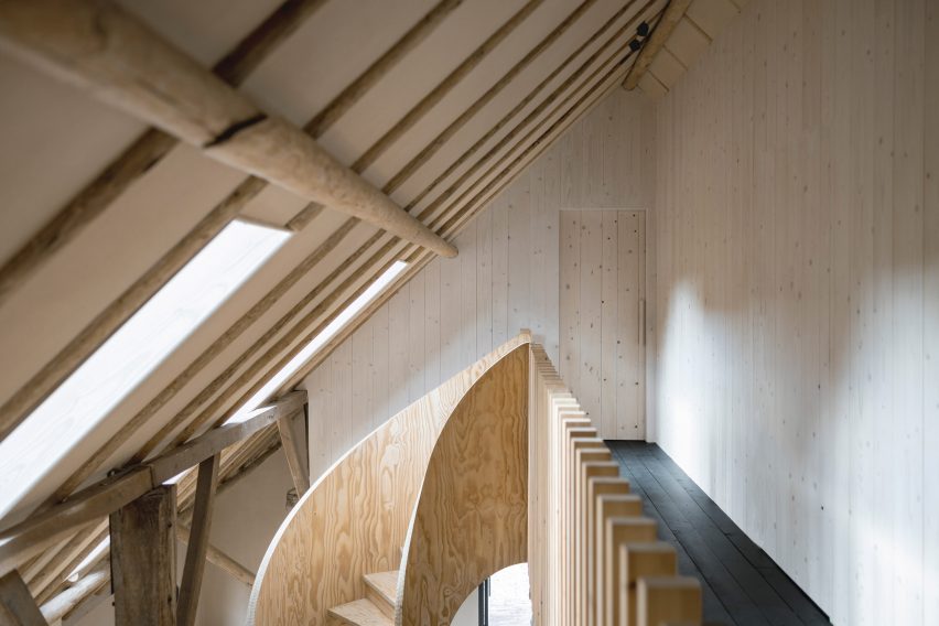 Plywood spiral staircase in Barn at the Ahof by Julia van Beuningen