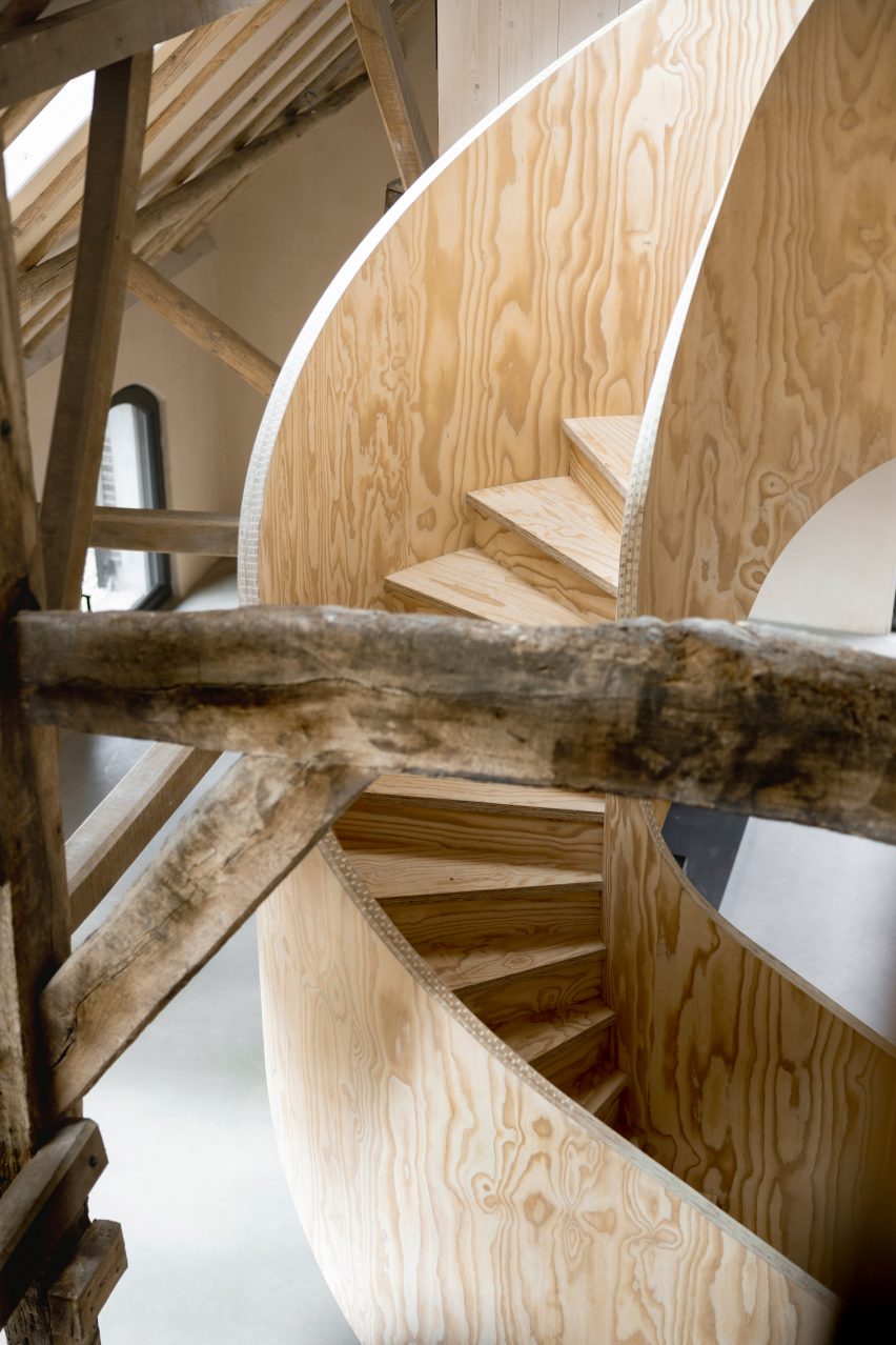 Plywood spiral staircase in Barn at the Ahof by Julia van Beuningen