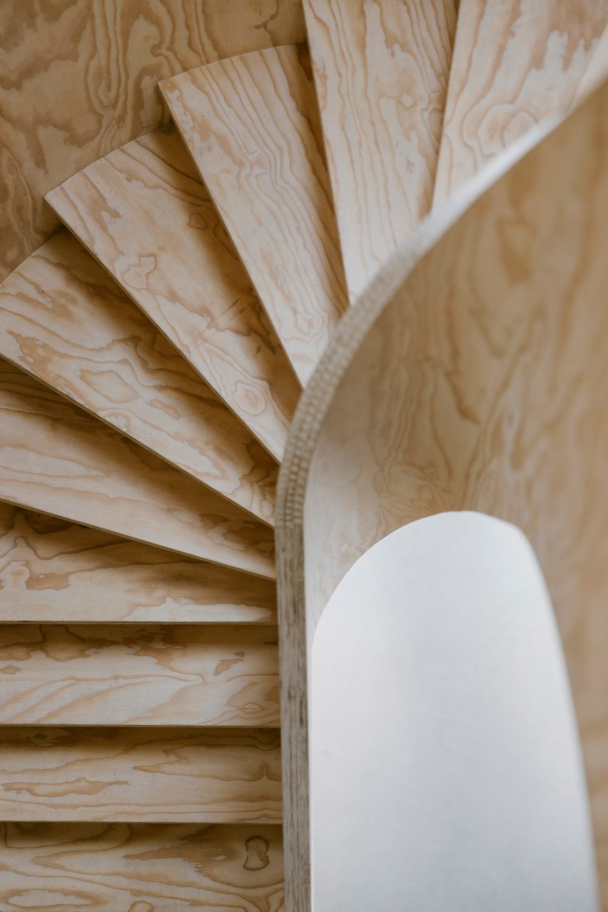 Plywood spiral staircase in Barn at the Ahof by Julia van Beuningen