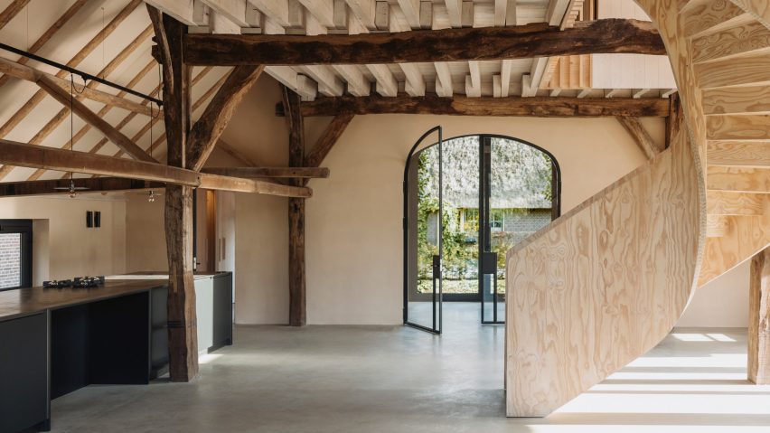 Plywood spiral staircase in Barn at the Ahof by Julia van Beuningen