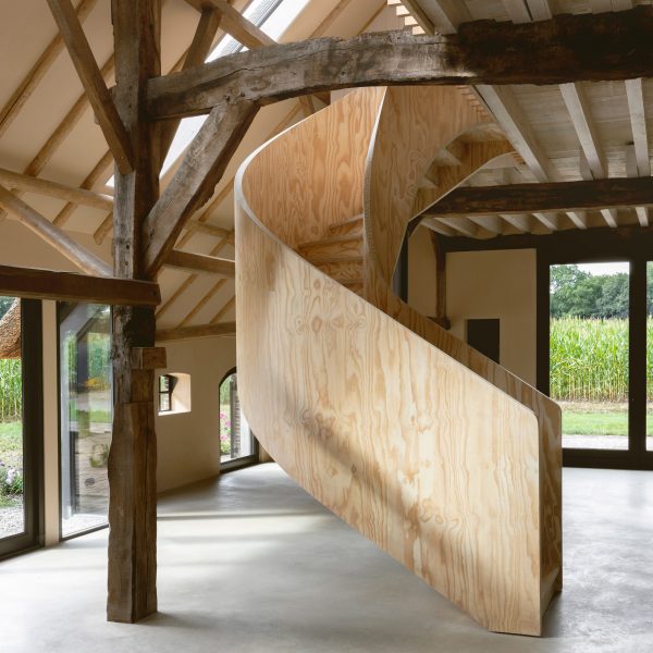 Plywood spiral staircase in Barn at the Ahof by Julia van Beuningen