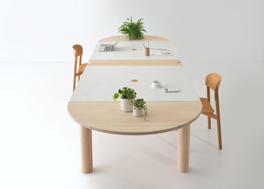Wood and recycled plastic office table with plants on top