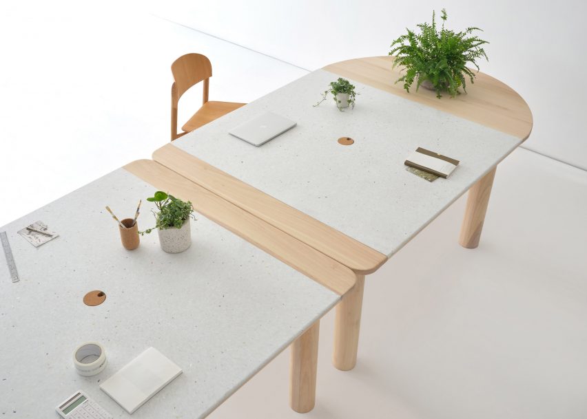 Wood and recycled plastic office table with plants on top