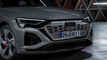 A silver Audi car featuring the new logo