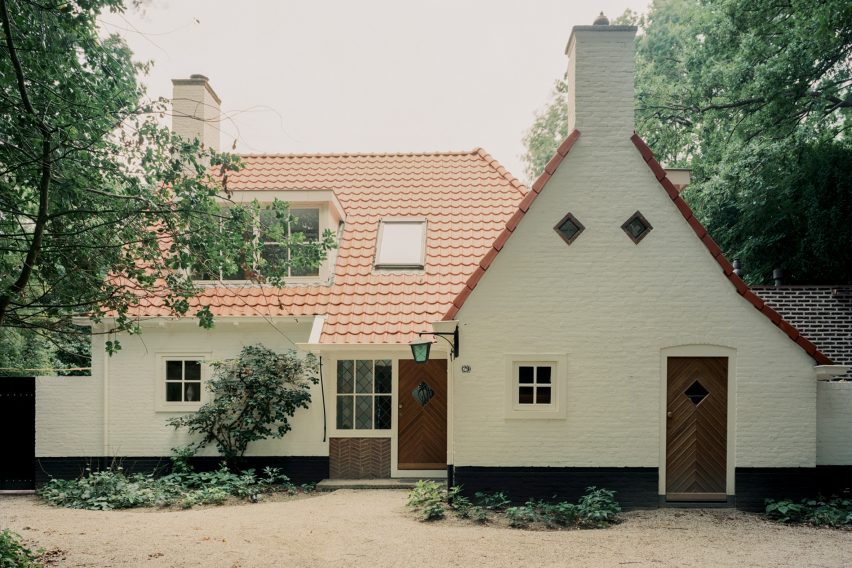Brick extension opens rural Dutch home out towards a forested garden